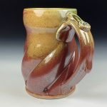 Handmade Stoneware Coffee Mug: Iron Red with White Ash Glaze, Twisted - item 3764 - Image 2